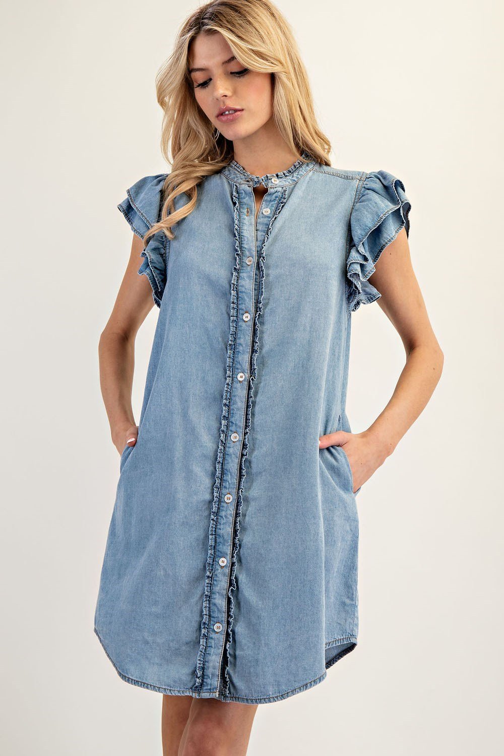 Chic chambray mini dress with layered ruffle sleeves, perfect for coastal boutique clothing and tropical vacation dresses.