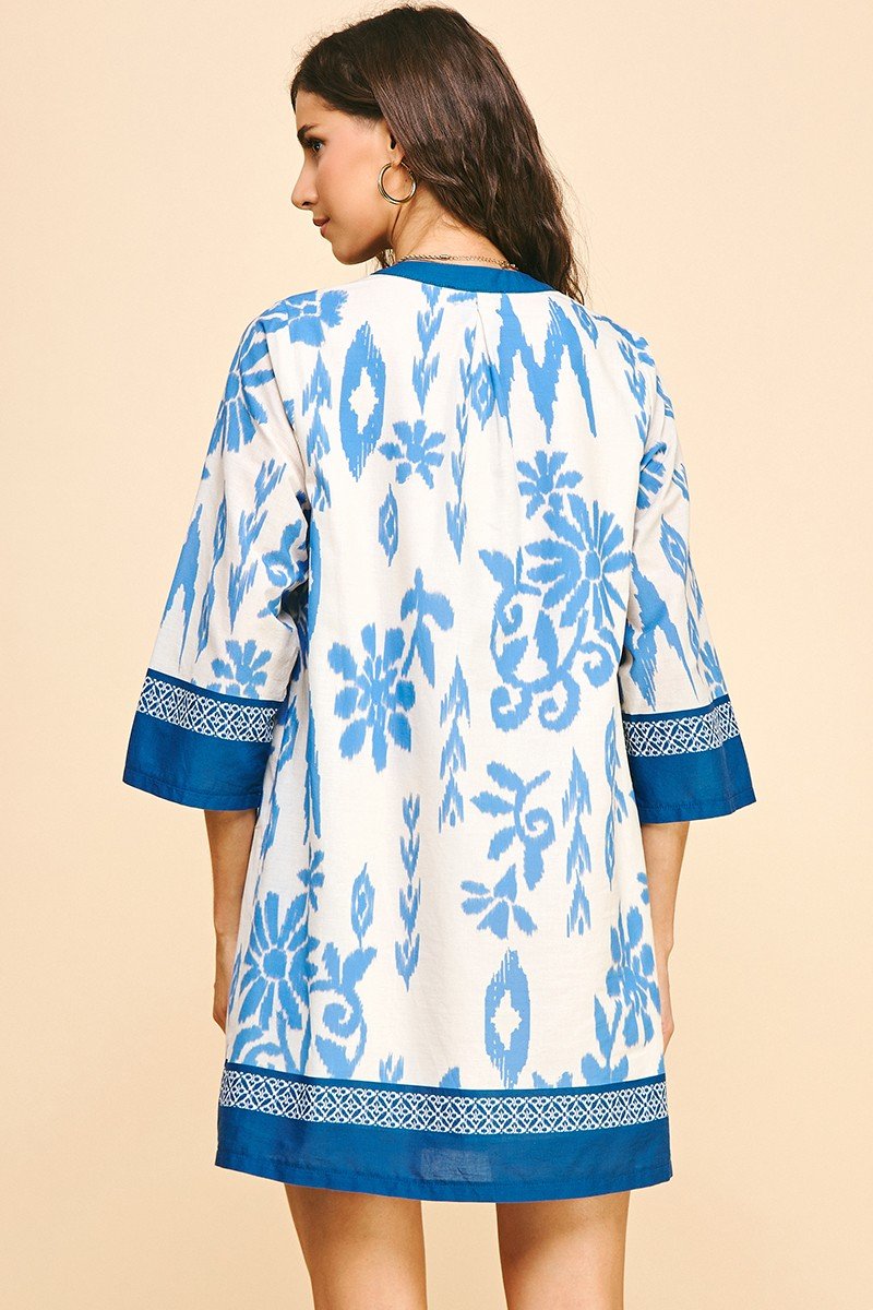 Natalia Dress featuring blue floral design, perfect for coastal boutique clothing and tropical vacation dresses.