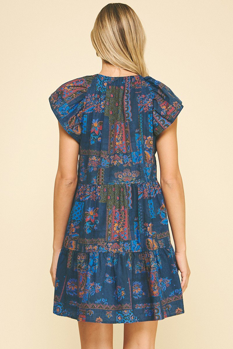 Back view of the Carlie Dress, a stylish and colorful beach dress from a coastal boutique, perfect for tropical vacations.