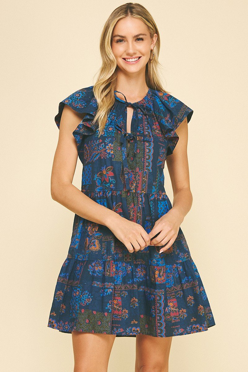 Carlie Dress in floral print, perfect for beach outings and tropical vacations. Curated women's fashion from a coastal boutique.