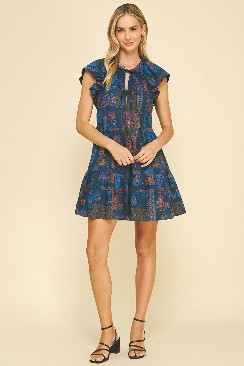 Carlie Dress in blue floral, perfect for coastal boutique clothing and tropical vacations. Stylish and comfortable for women.