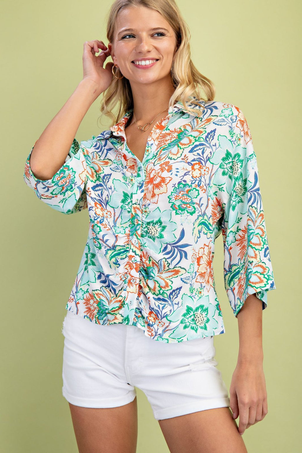 Mint mixed floral button front top perfect for coastal boutique clothing, paired with shorts, ideal for tropical vacations.