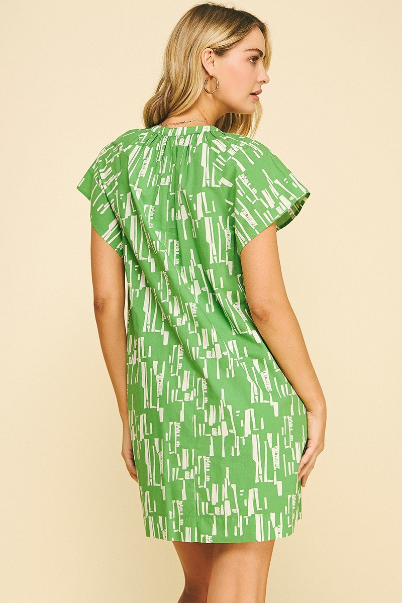 Back view of the Emily green print dress, perfect for summer events from a coastal boutique clothing.