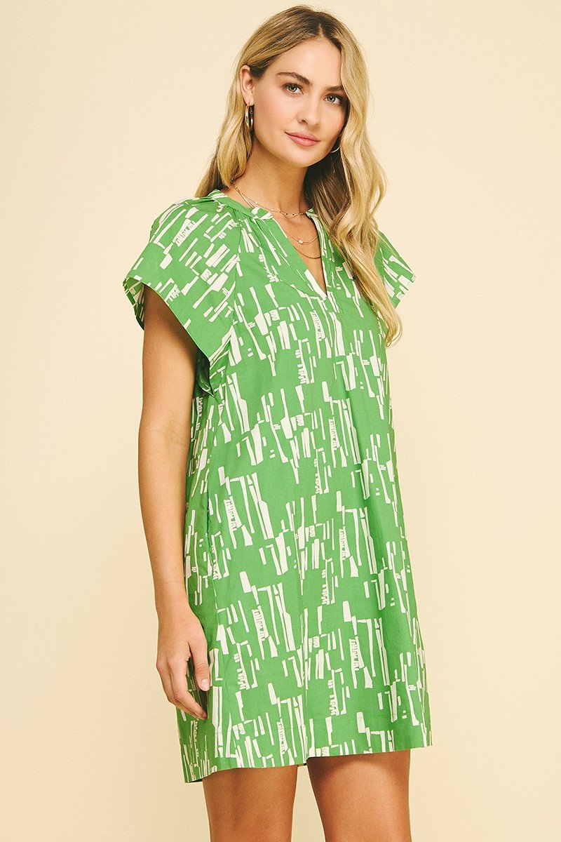 Beautiful green print midi dress from coastal boutique clothing, ideal for summer events and casual outings.