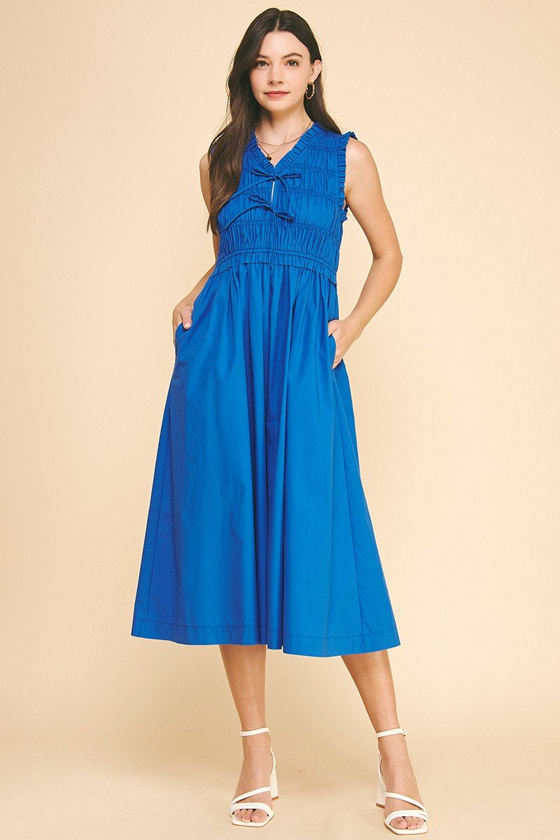 Olivia blue midi dress with smocking detail, perfect for coastal boutique clothing and summer beach outings.