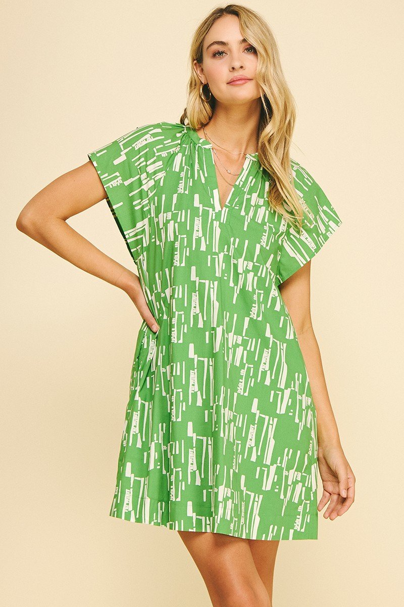 Beautiful green print midi dress with v-neckline, perfect for summer events from a coastal boutique clothing.