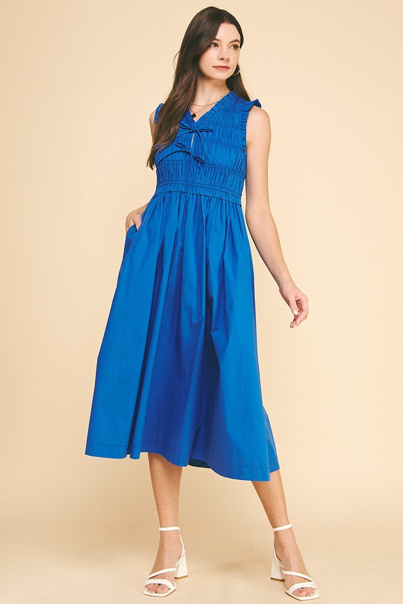 Olivia Blue Midi Dress with smocking and V-neck, perfect for summer beach outings at Port Aransas boutique.