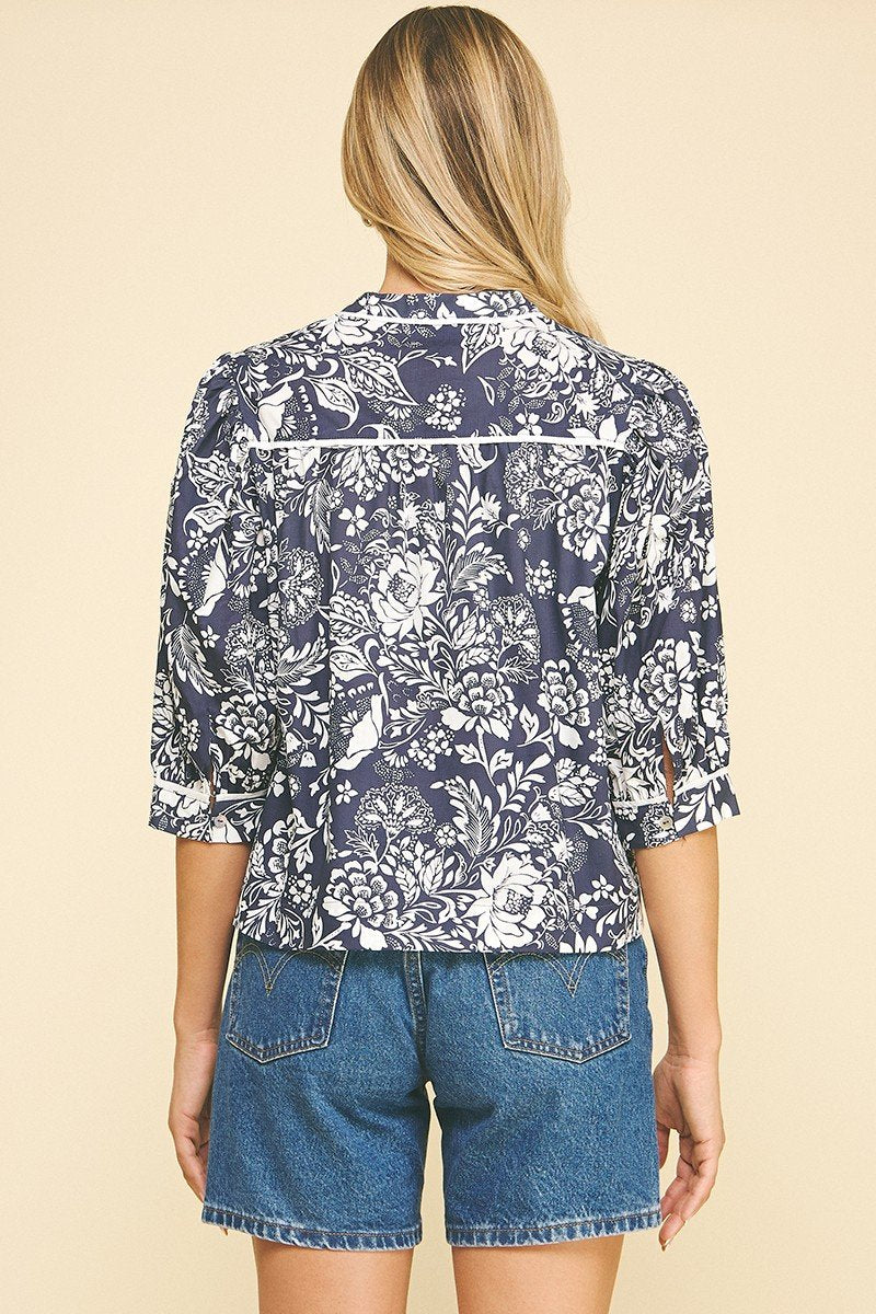 Navy floral print top with balloon sleeves, perfect for coastal boutique clothing and trendy summer styles.