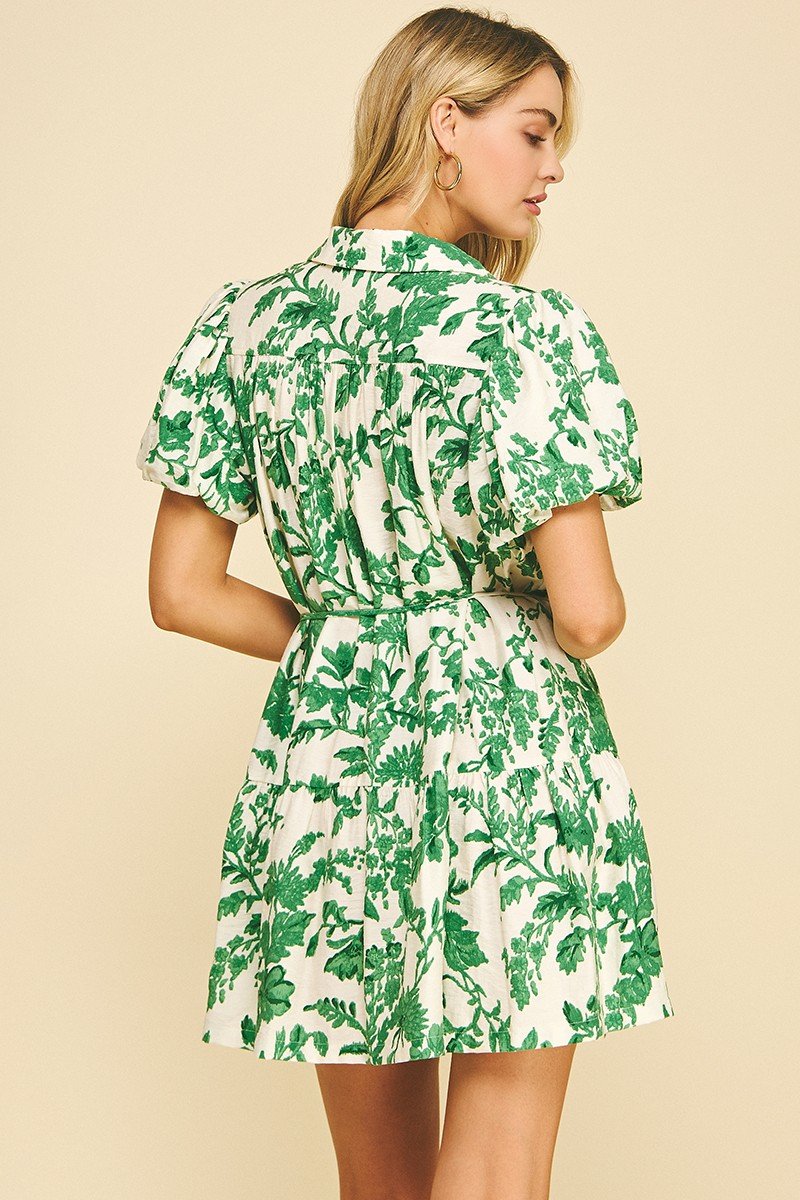 Green floral mini dress from coastal boutique clothing, perfect for spring and summer outings. Ideal for brunch or beach wear.