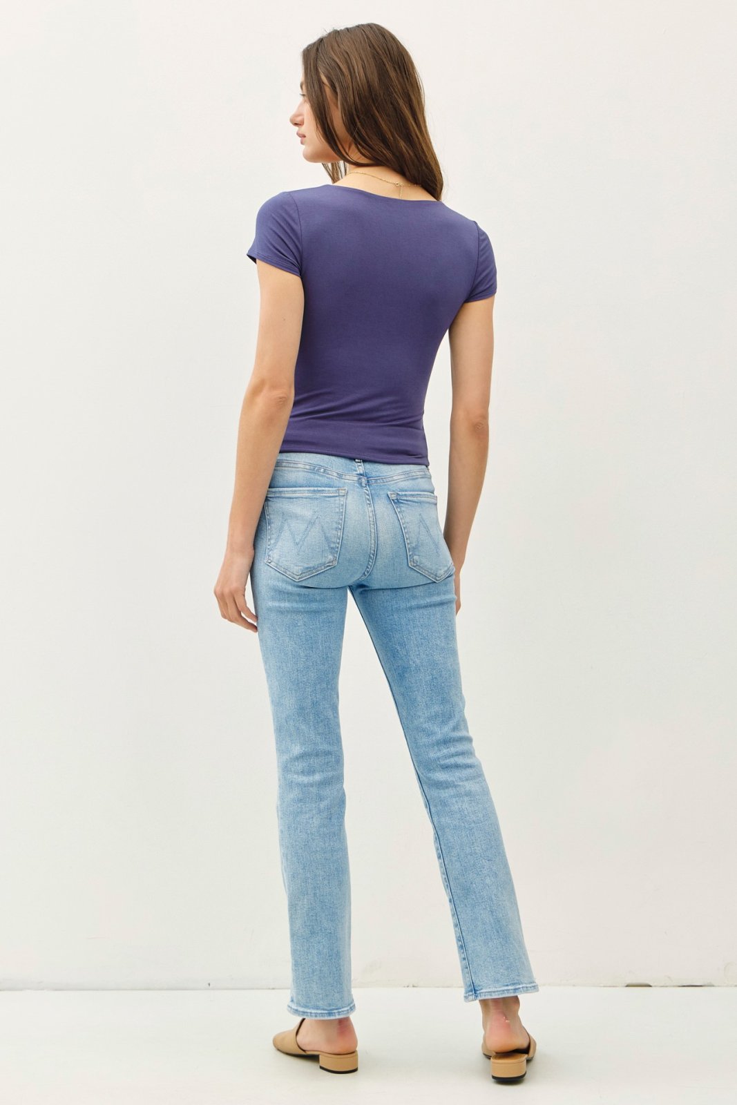 Slate blue double-lined knit tee with stylish fit, showcasing curvy plus size fashion at a coastal boutique.