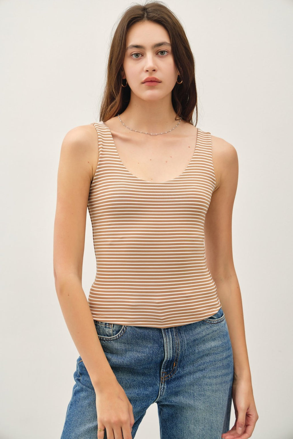 Mocha stripe double-lined tank top, perfect for layering and summer style at a coastal boutique clothing store.