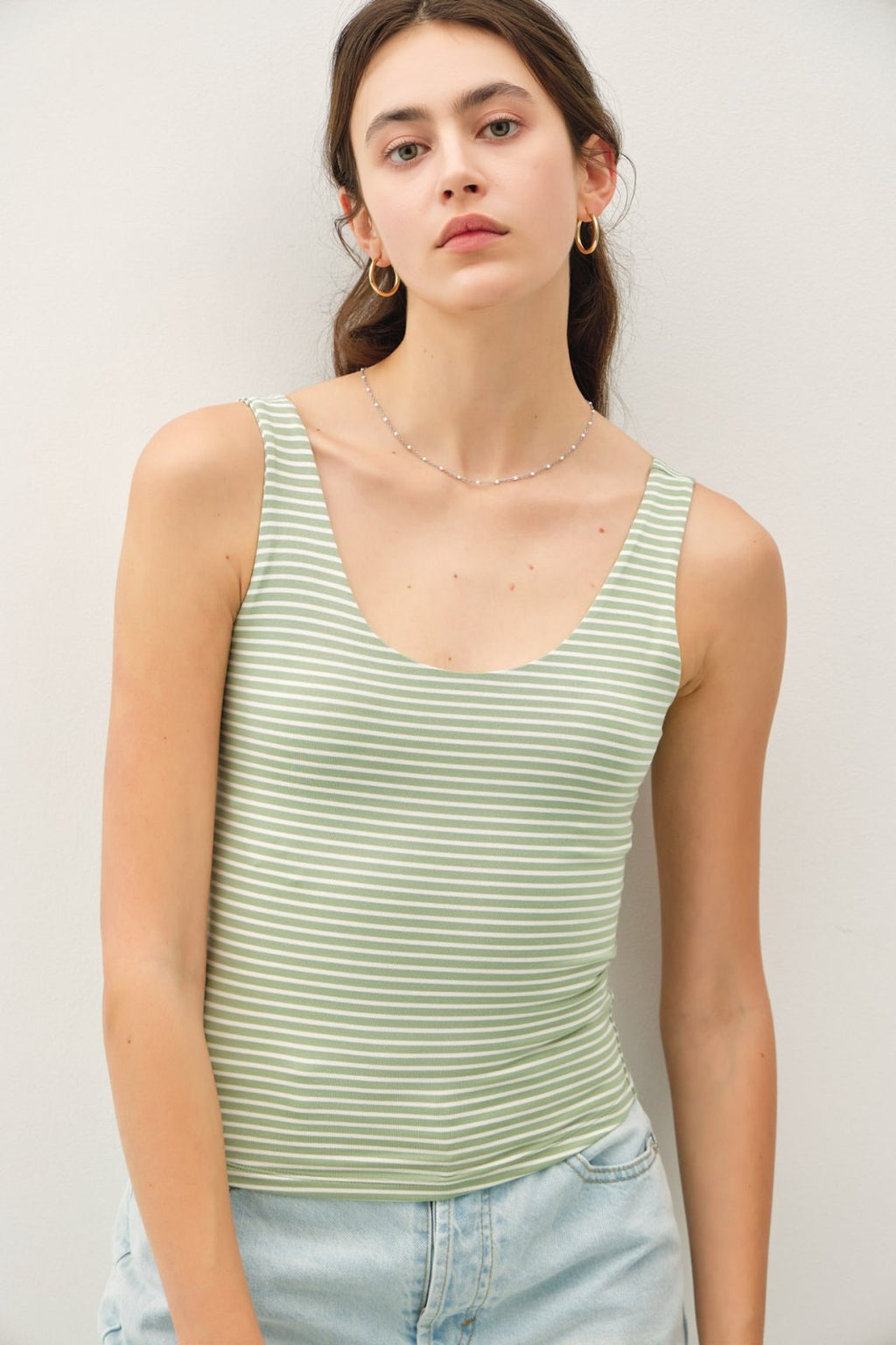 Pistachio striped double-lined tank top, perfect for layering, part of curated women's fashion at our coastal boutique.