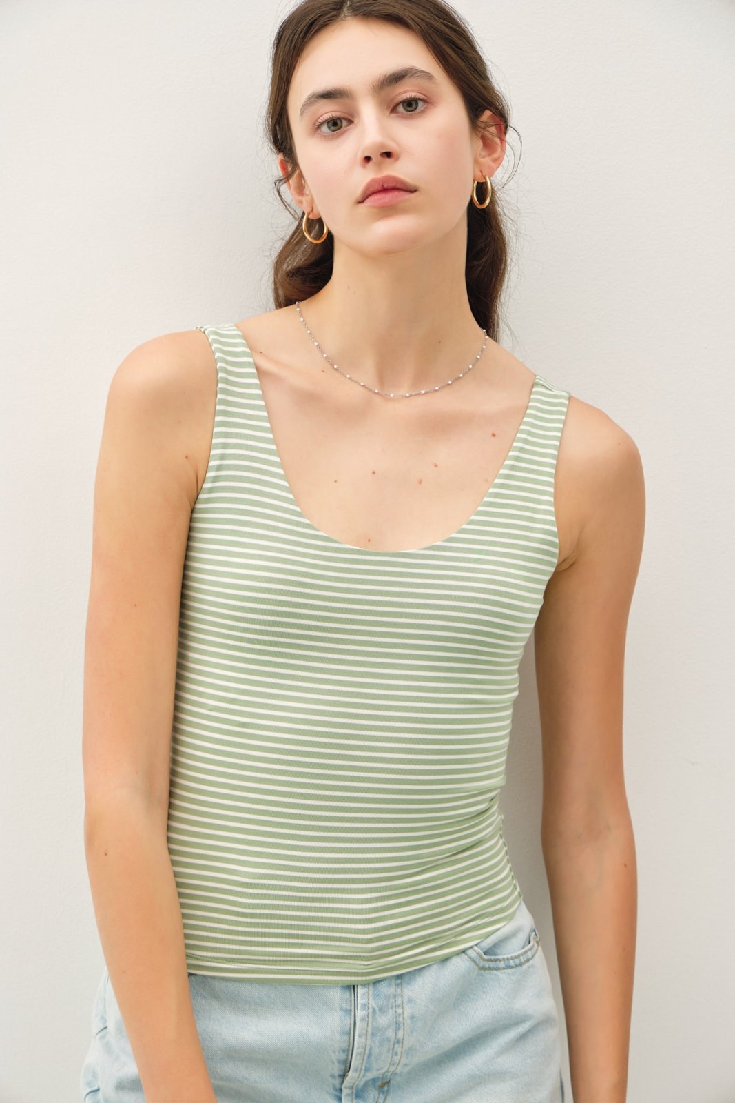 Pistachio striped double-lined tank top, perfect for layering, part of curated women's fashion at our coastal boutique.