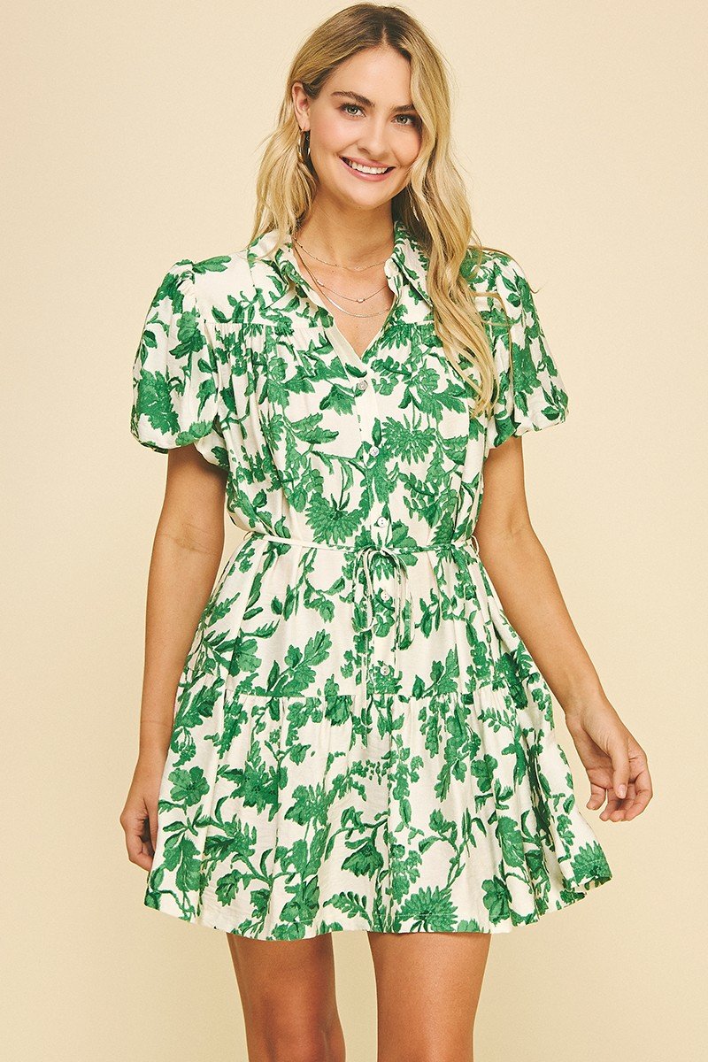 Chic green floral mini dress from a Port Aransas boutique, perfect for beach outings and tropical vacations.