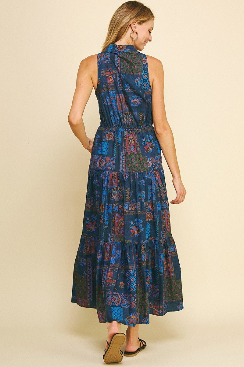 Sleeveless blue floral dress with tiers, perfect for coastal boutique clothing and tropical vacation dresses.