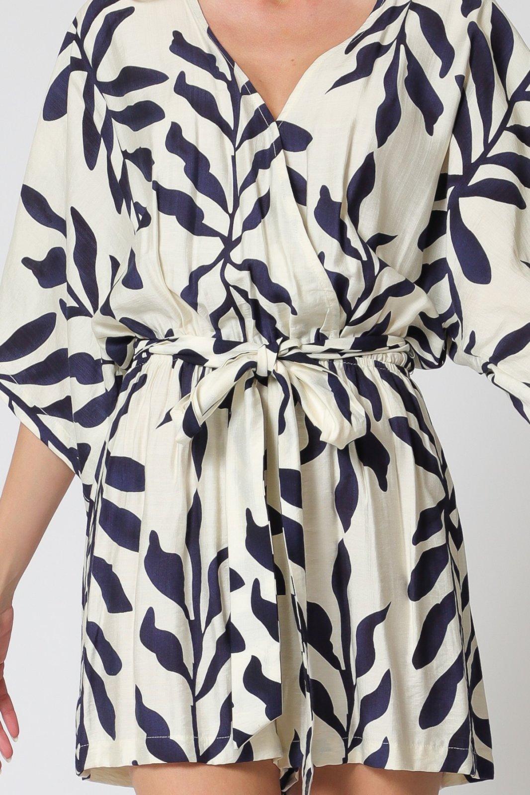 Ivory & navy Vivian romper with kimono sleeves and self-tie belt, perfect for coastal boutique clothing and tropical vacations.