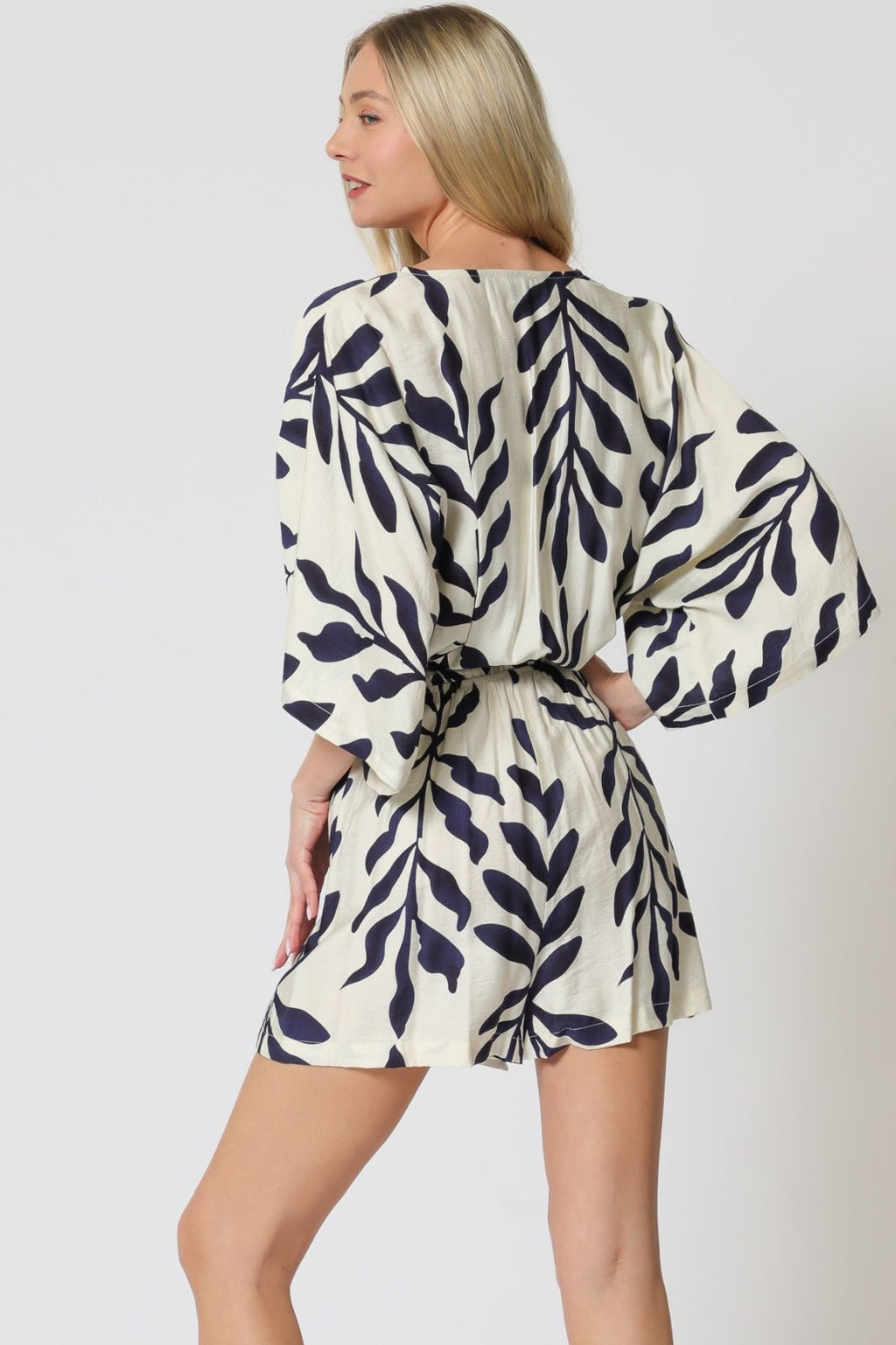 Stylish Ivory & Navy romper with kimono sleeves, perfect for coastal boutique clothing and tropical vacation dresses.