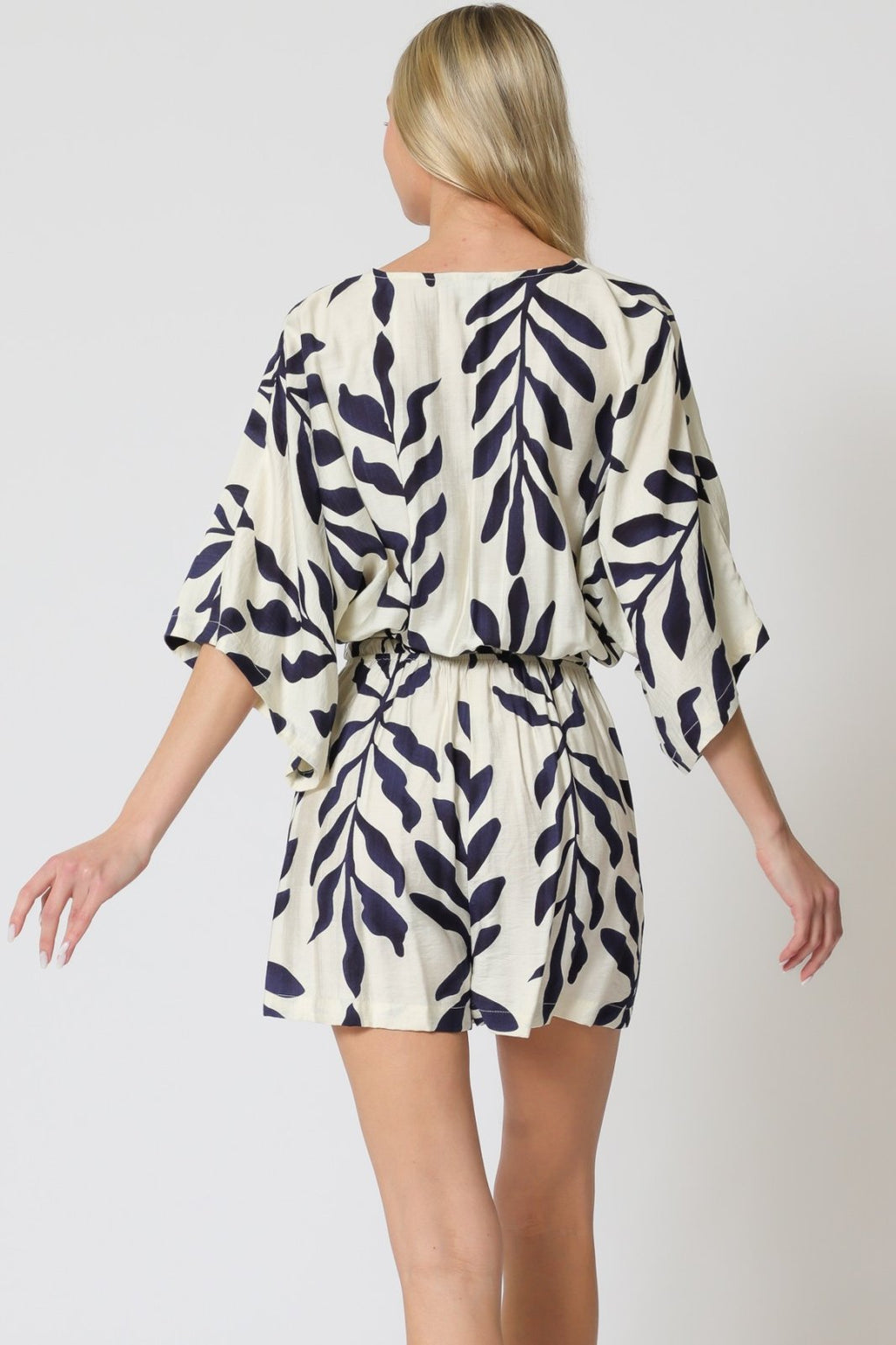 Stylish Vivian Romper in ivory and navy, perfect for coastal boutique clothing and tropical vacation outfits.