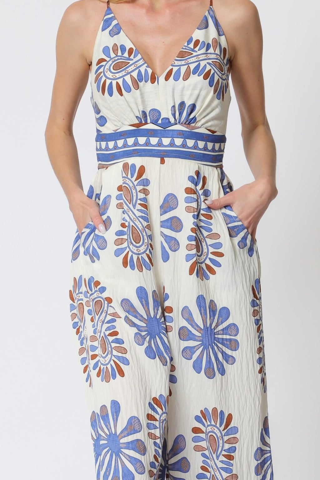 Stylish blue print sleeveless jumpsuit from coastal boutique clothing, perfect for summer outings and tropical vacations.