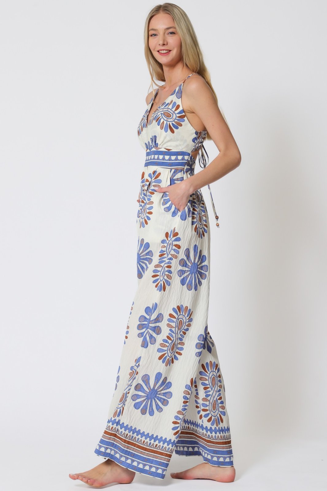 Stylish blue print jumpsuit from coastal boutique clothing, perfect for tropical vacations and casual outings.