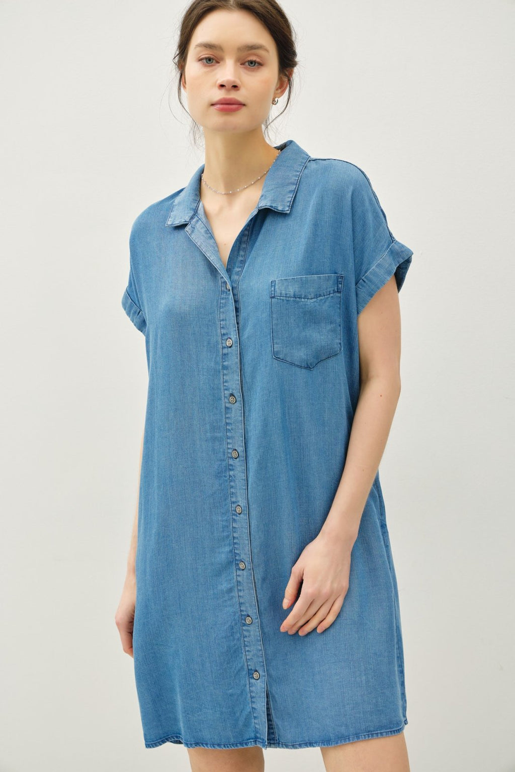 Medium wash Tencel denim shirt dress; perfect for coastal boutique clothing and tropical vacation styles.