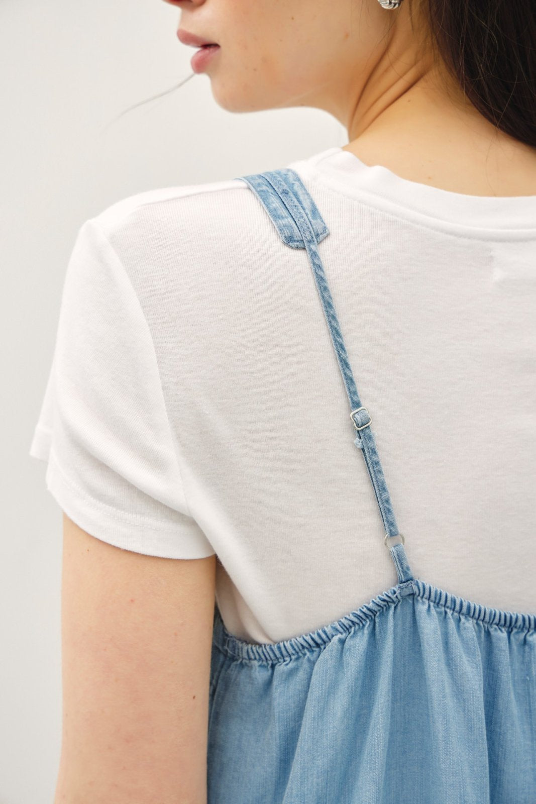 Close-up of adjustable shoulder straps on a breezy Tencel dress, ideal for coastal boutique clothing and tropical vacations.