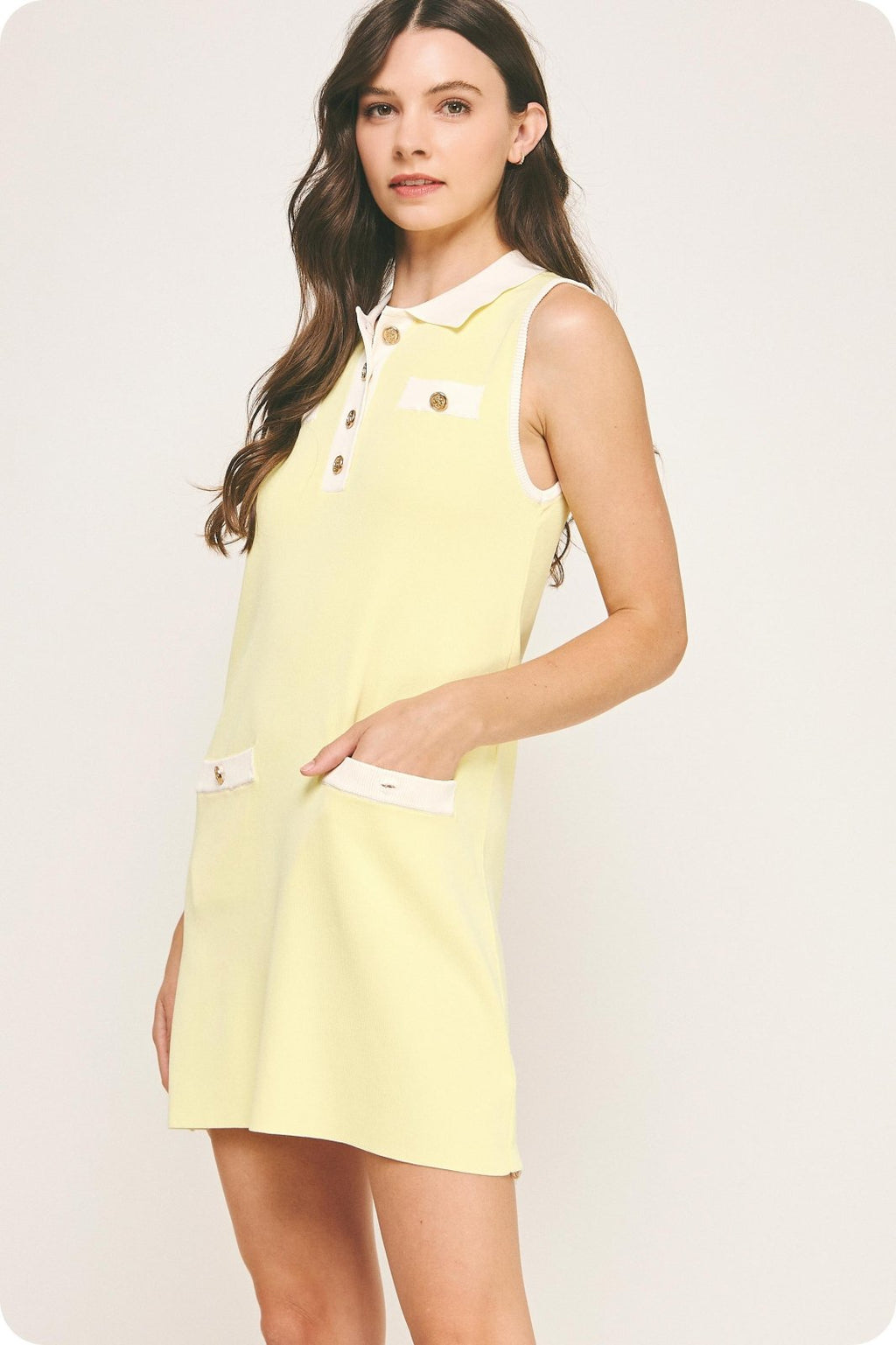 Lemon yellow sleeveless polo mini dress with pockets, perfect for beach outings and coastal boutique clothing.