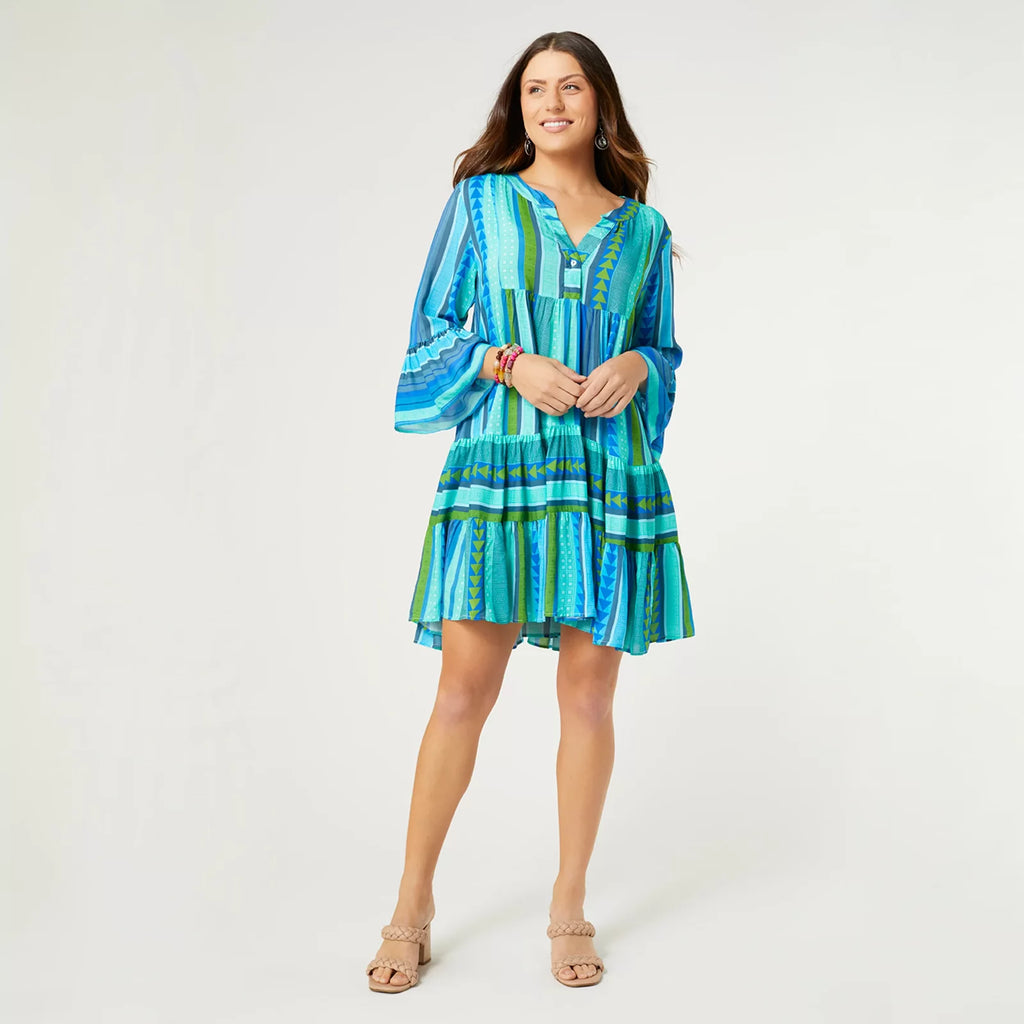 Milena Ruffle Sleeve Tunic Dress in vibrant blue print, perfect for coastal boutique clothing and tropical vacations.