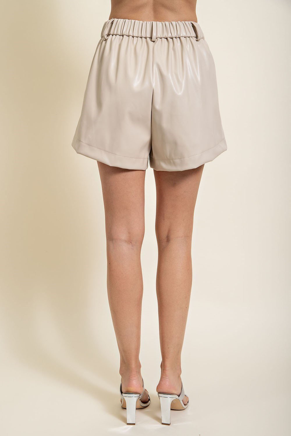 SOFT CREAM LEATHER-LIKE SHORTS seen from the back, trendy coastal style at Raggdoll Boutique in Port Aransas.