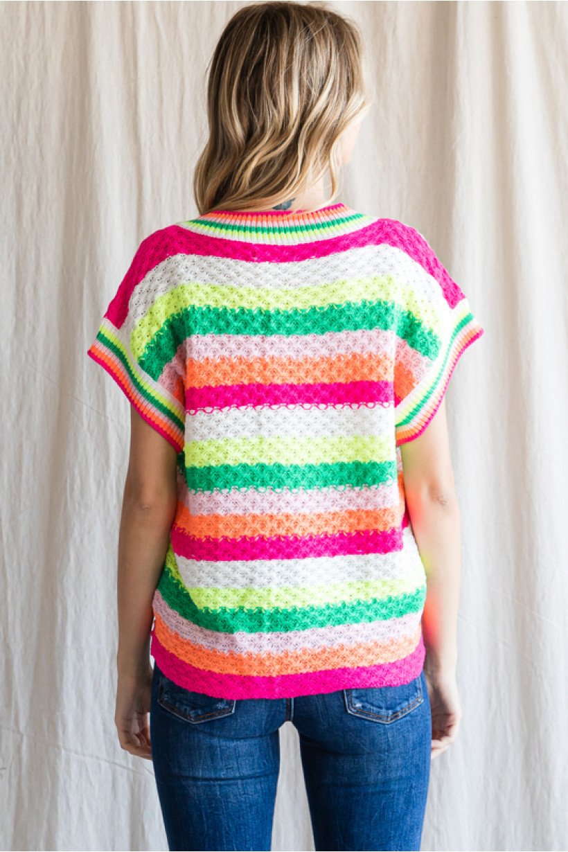 Back view of BRIGHTS STRIPED SWEATER showcasing colorful stripes, perfect from Raggdoll Boutique for trendy coastal style.