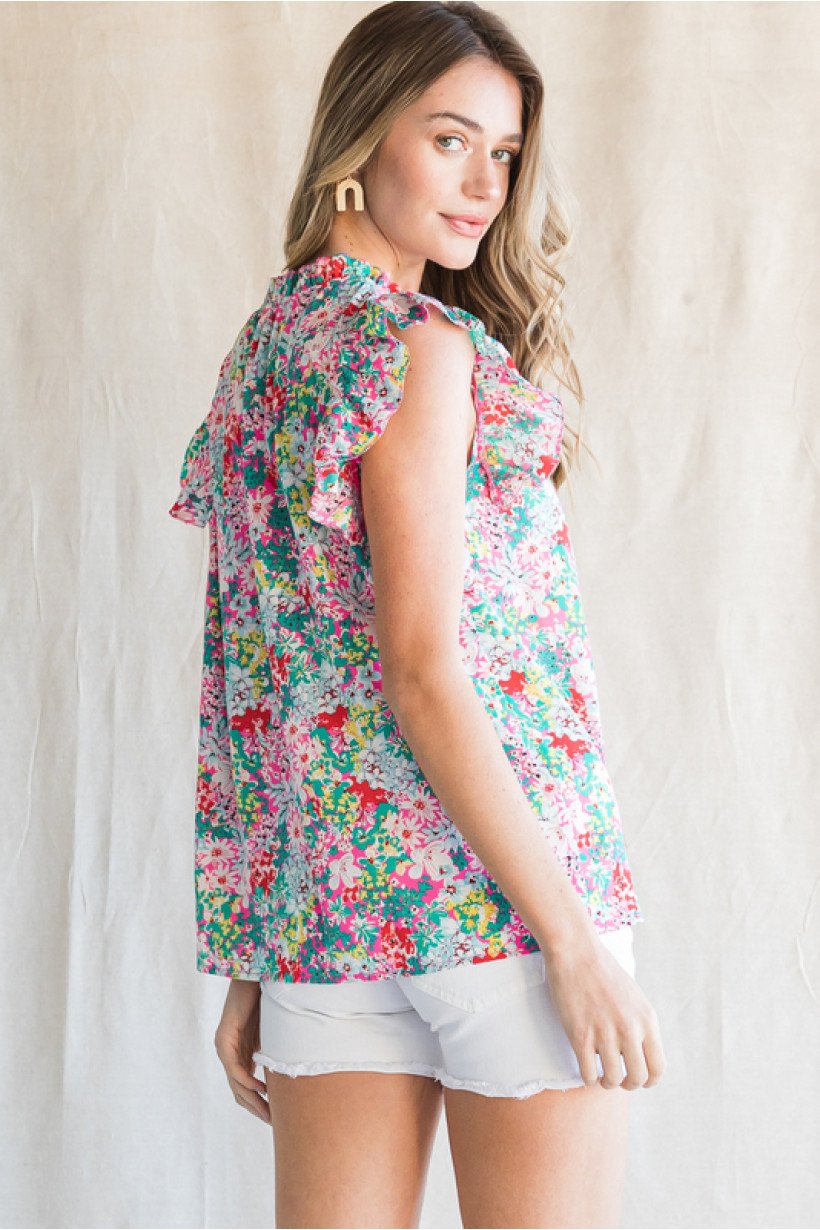 PINK, YELLOW GREEN FLORAL TOP featuring ruffled shoulder, tassel tie, from Raggdoll Boutique, perfect for summer outfits Texas.