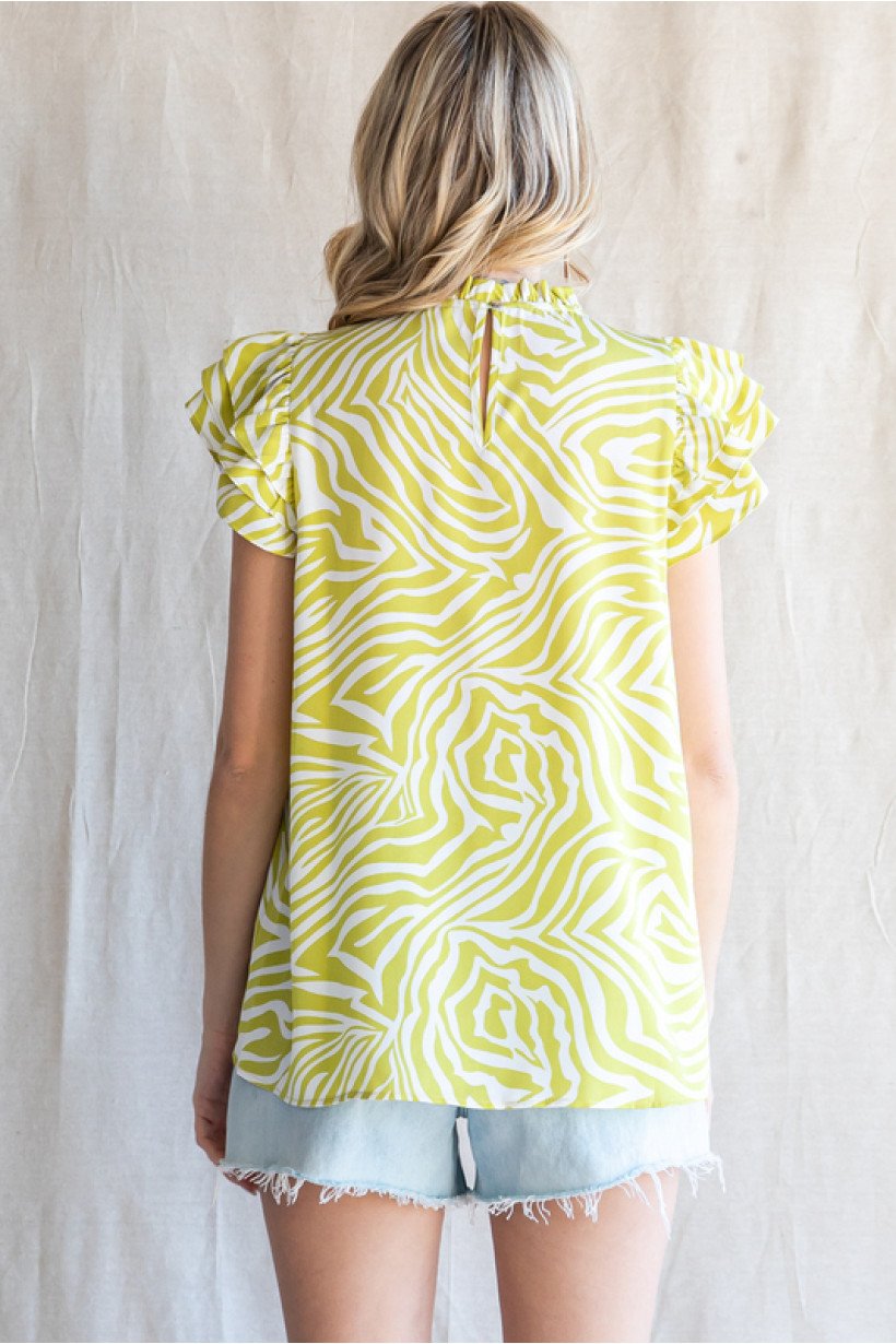 Lime and white print top for women from coastal boutique, perfect for tropical vacations and casual beach outings.