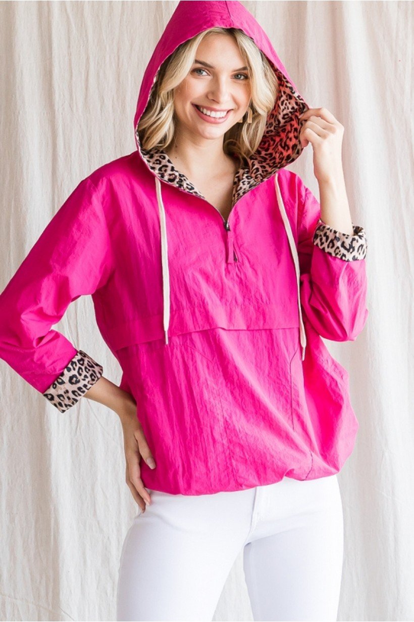 Bright pink windbreaker pullover with leopard print hood and cuffs, perfect for coastal boutique clothing and stylish tops for women.