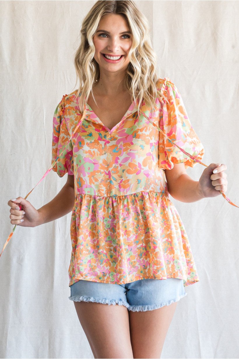 PINK, YELLOW AND TURQUOISE TOP from Raggdoll Boutique, featuring short puffed sleeves and self-tie neck for trendy coastal style.