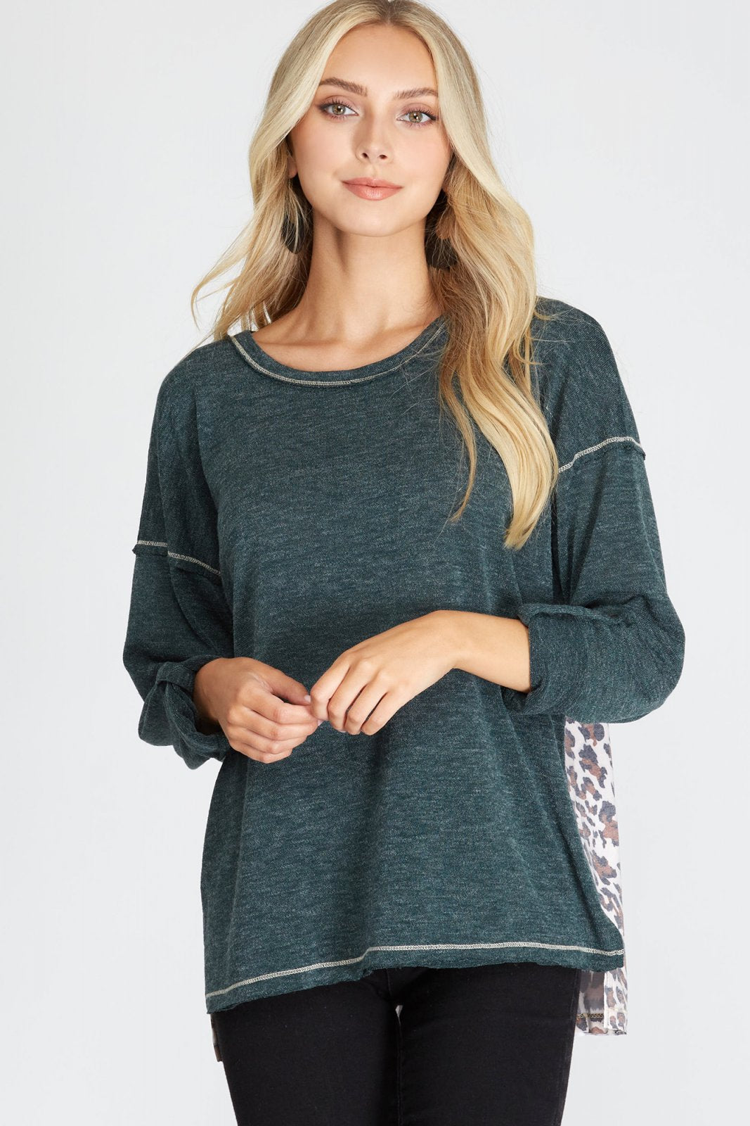 TEAL LONG SLEEVE WITH ANIMAL PRINT ON BACK TOP from Raggdoll Boutique, perfect for coastal fashion and summer outfits Texas.