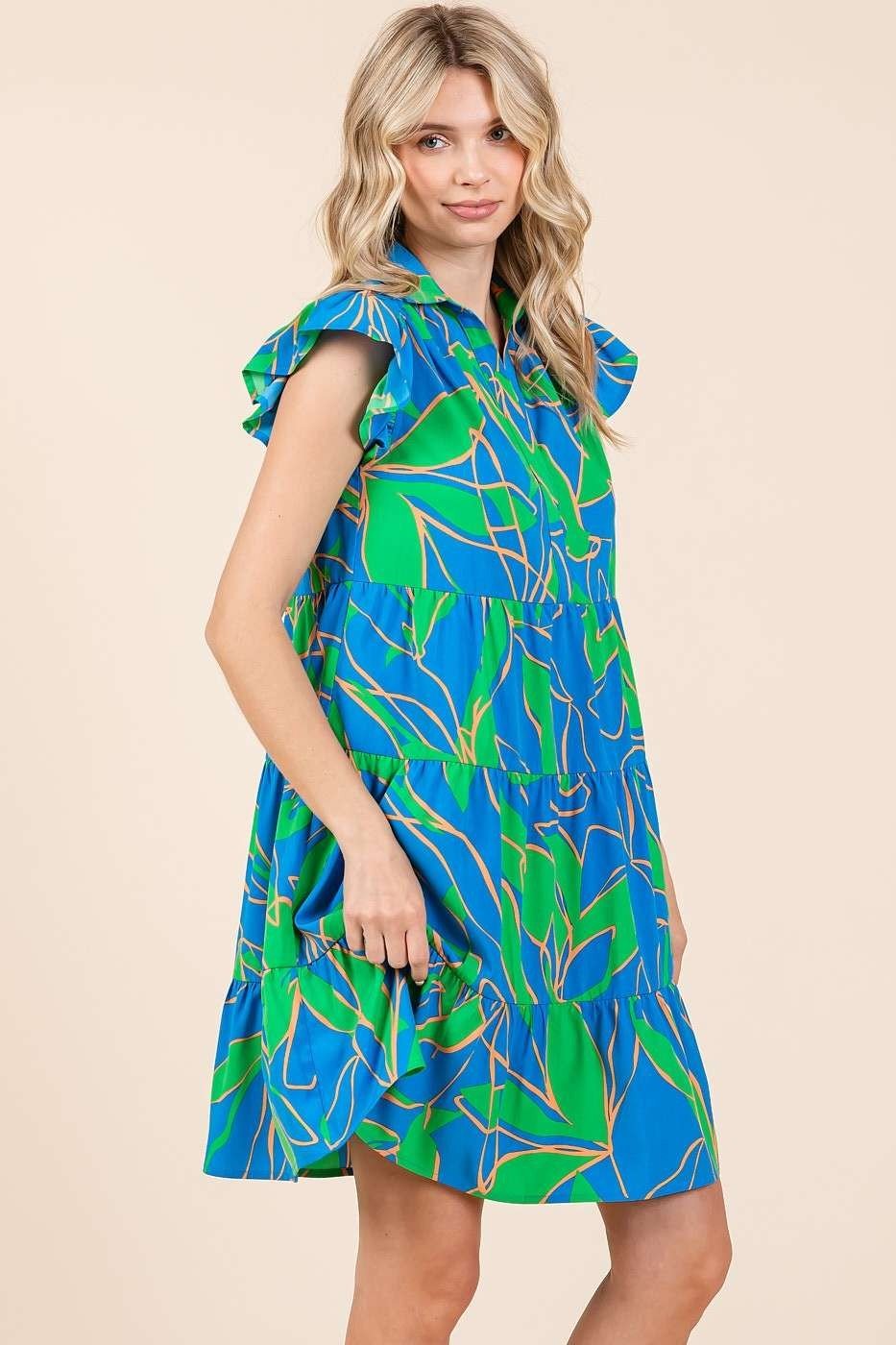 Lola Dress in vibrant blue and green, perfect for coastal boutique clothing and tropical vacations. Stylish and trendy beach dress.