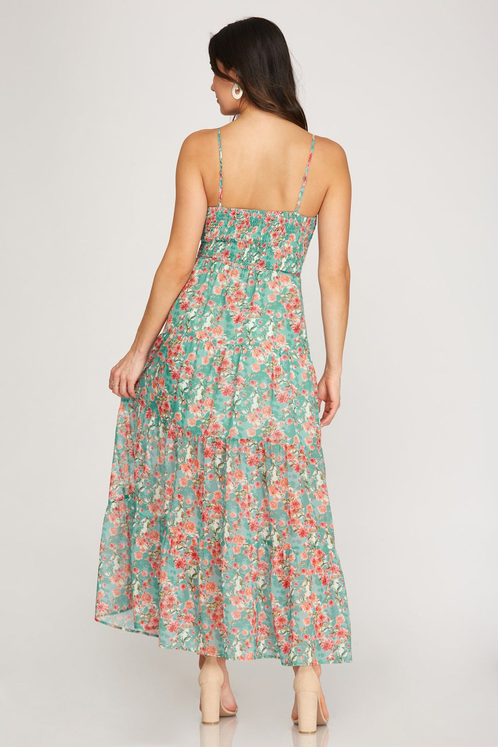 Back view of FIELD OF FLOWERS MAXI DRESS from Raggdoll Boutique showcasing a trendy coastal style.