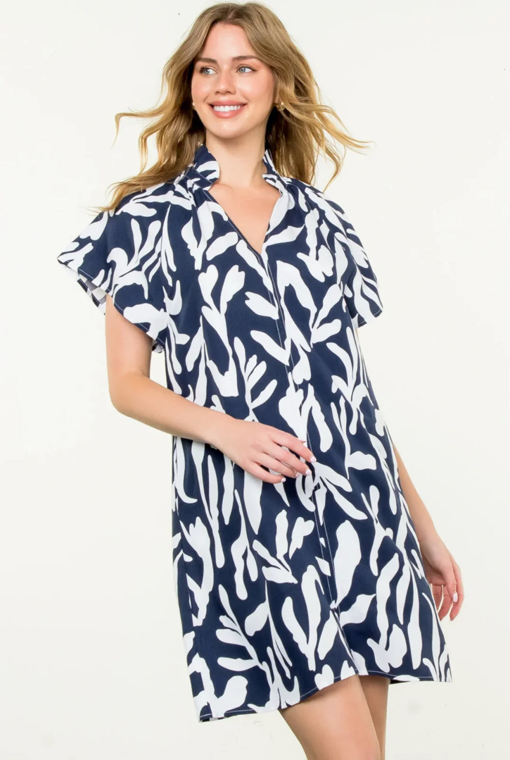 Navy short sleeve Lorna Dress with a bold print, ideal for casual outings and tropical vacations from a coastal boutique.