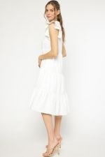 Woman in WHITE IS RIGHT DRESS showcasing trendy coastal style at Raggdoll Boutique, Port Aransas boutique.