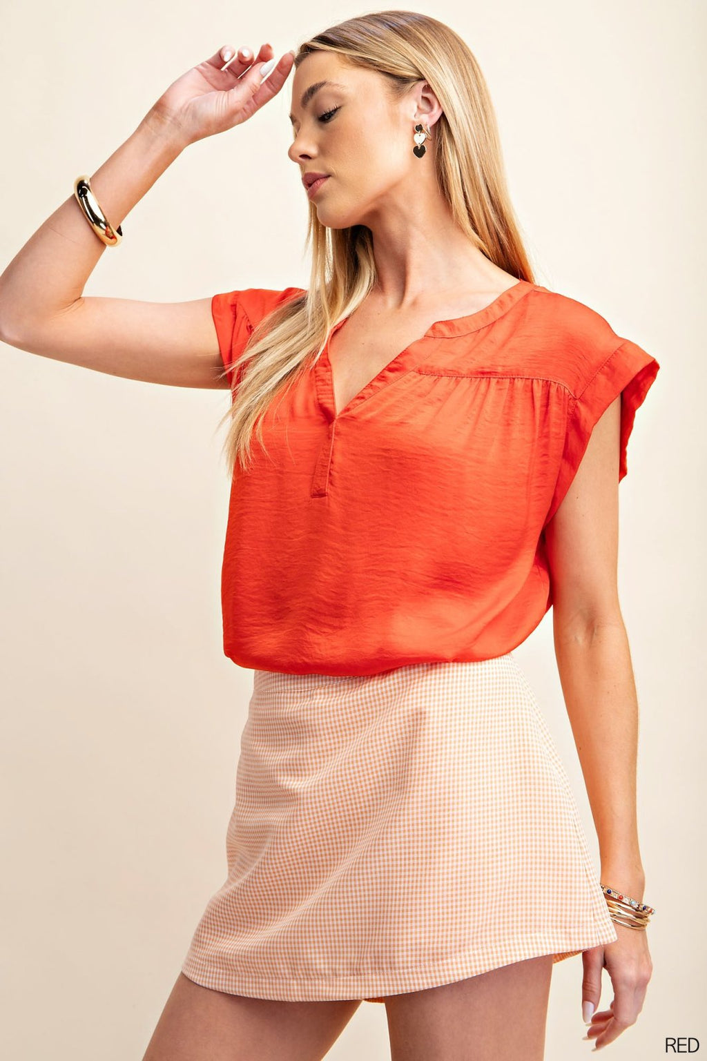 CANDY APPLE RED SATIN TOP styled with a chic skirt, from Raggdoll Boutique, perfect for coastal fashion.