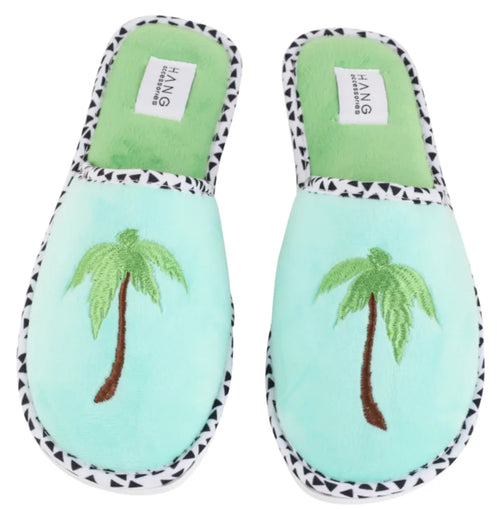 Mint green slippers with palm tree embroidery, perfect for cozy evenings and tropical vibes at coastal boutique clothing stores.