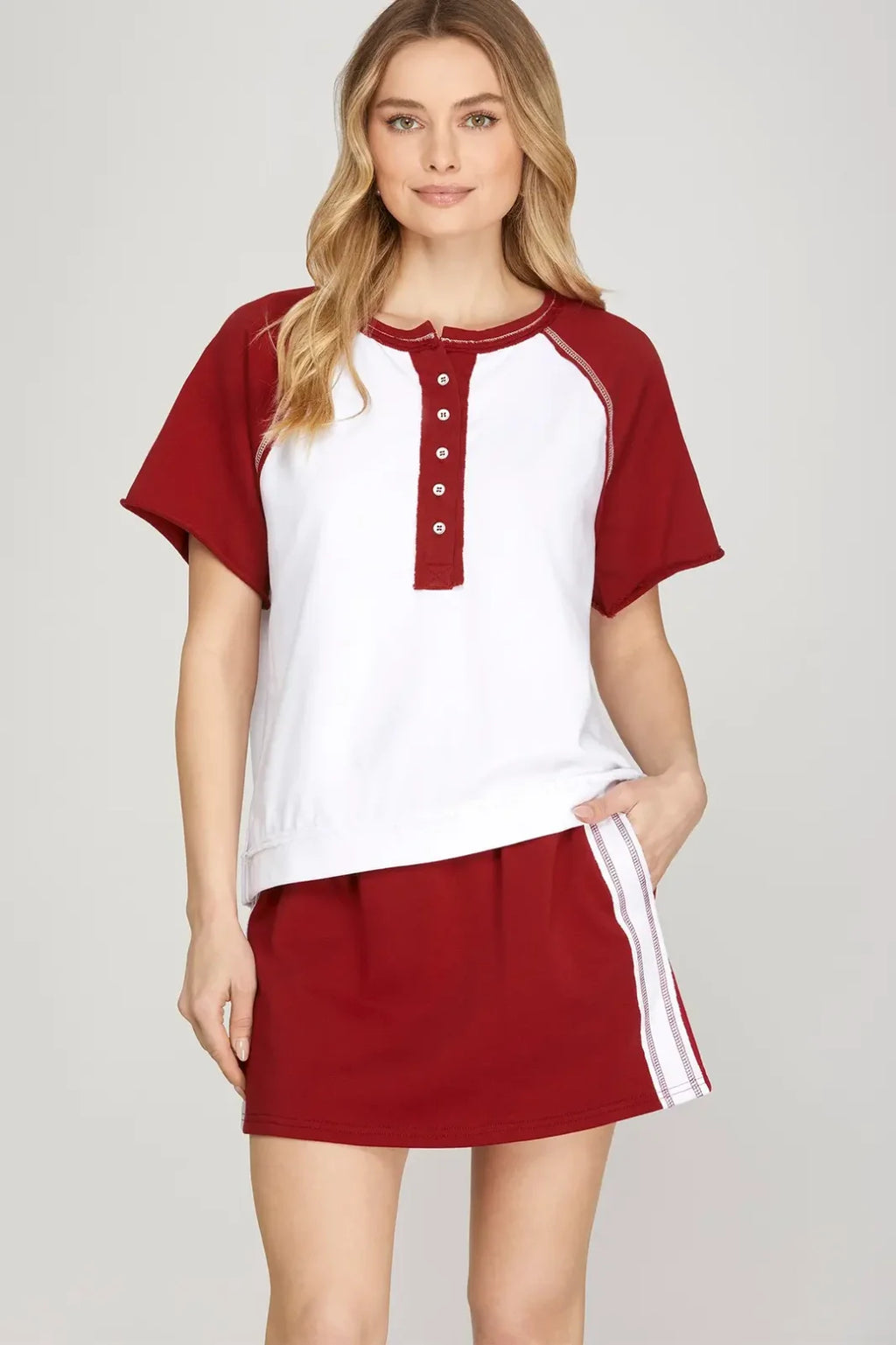 My Game Day Skirt in maroon, perfect for tailgating or campus wear. Coastal boutique clothing style with functional pockets.