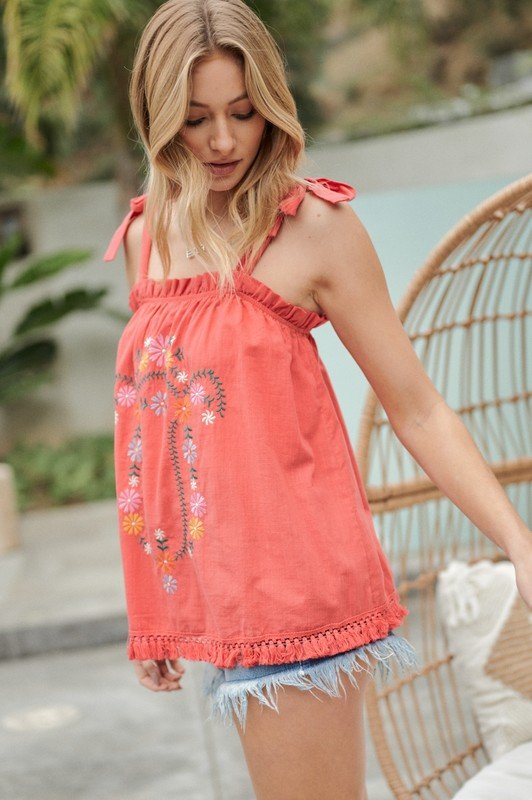 Tomato red embroidered top from Raggdoll Boutique, perfect for summer outfits and coastal style.