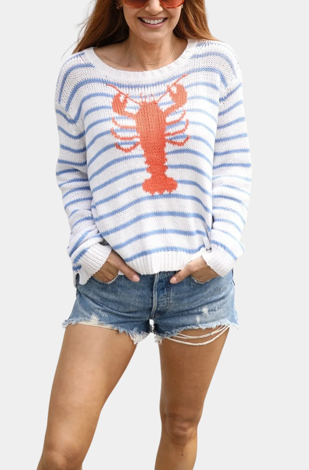 Soft knit sweater with lobster design and blue stripes, perfect for coastal boutique clothing and summer beach outfits.