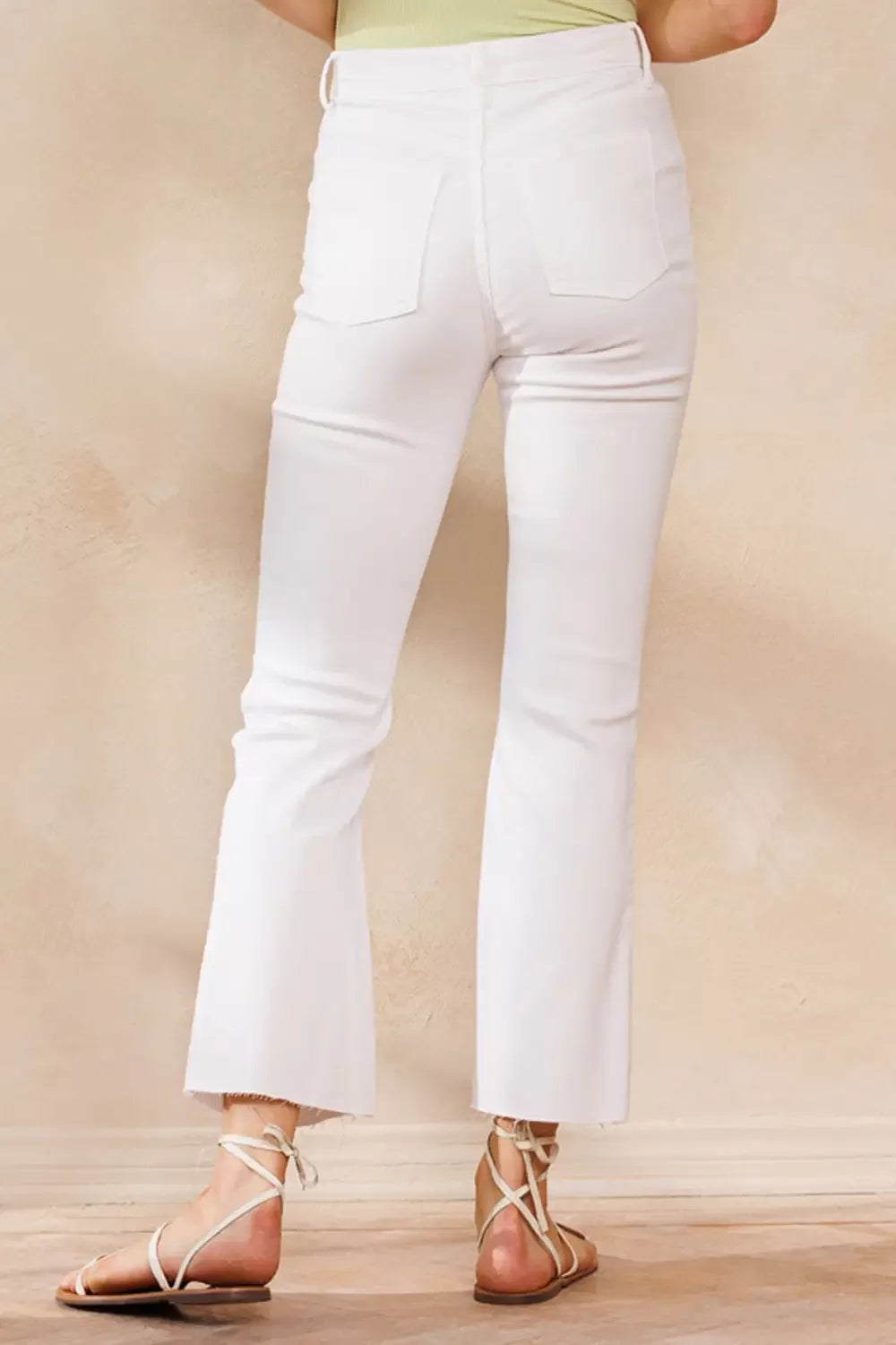 SP HIGH RISE KICK FLARE JEANS WITH RAW CUT HEM (WHITE) from Raggdoll Boutique, perfect for trendy coastal style.