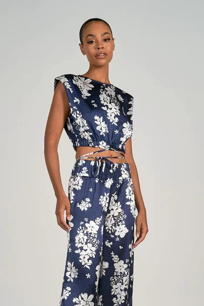 Model wearing ELAN Capri Print Crew Crop Top with Navy Capri Pants, ideal for coastal boutique clothing and tropical vacations.