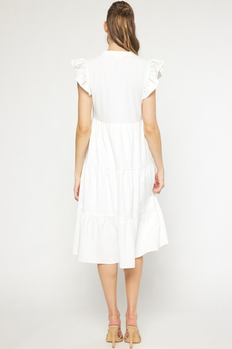 Woman wearing the WHITE IS RIGHT DRESS from Raggdoll Boutique, a trendy coastal style for summer outfits.