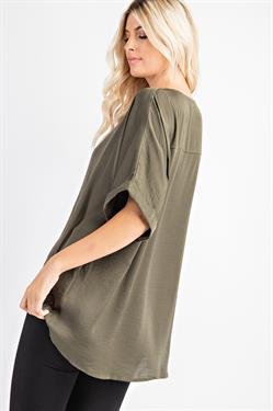 ARMY HI-LO TOP displayed on a model, showcasing its trendy high-low design and sleeve cuffs from Raggdoll Boutique.