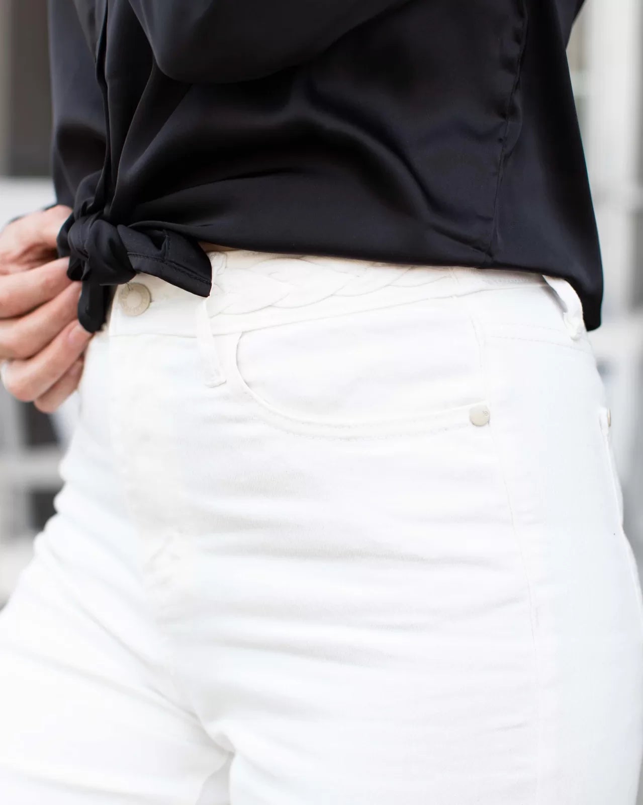 JUDY BLUE HW BRAIDED WHITE JEAN-WIDE LEG styled with a black shirt, perfect for trendy coastal style from Raggdoll Boutique.