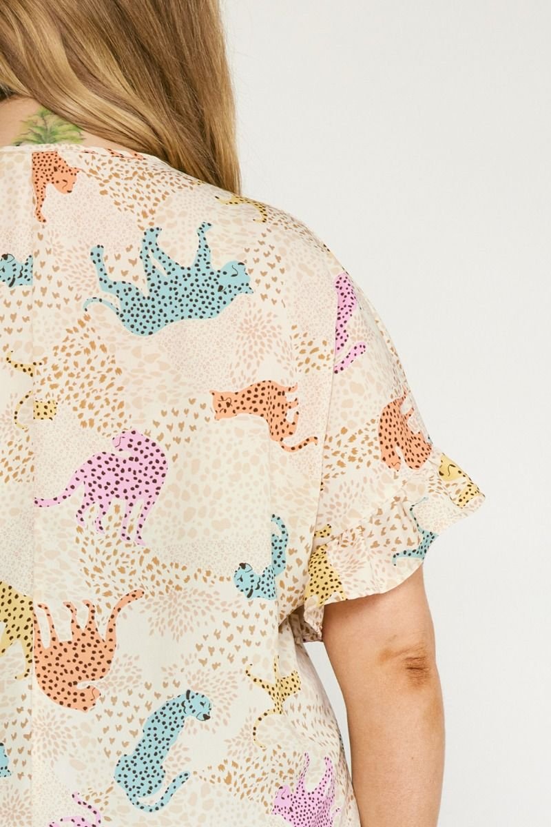 Image of PLUS CREAM MULTI CHEETAH TOP showcasing playful leopard print in pastel colors, perfect for summer outfits Texas.